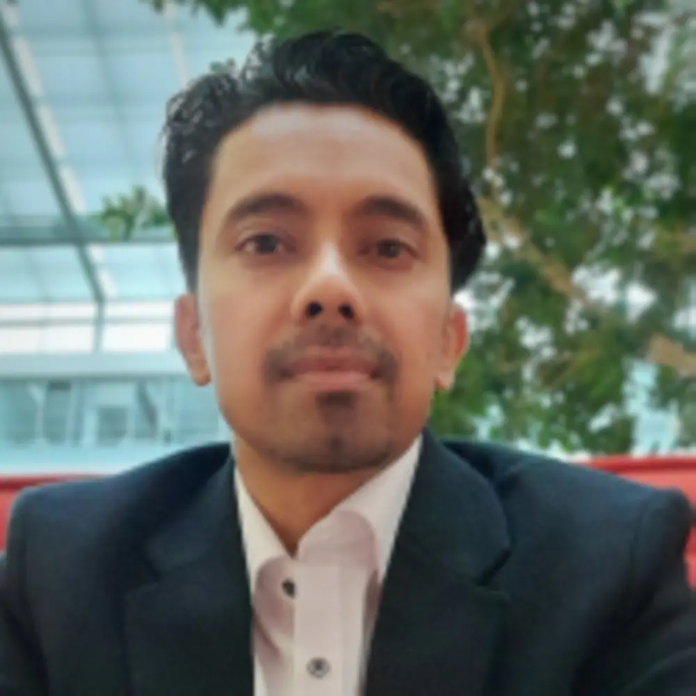 Portrait photo of Saurav Palit, Head of Smart Cleaning & Washing at Henkel Consumer Brands, that shows him smiling into the camera.